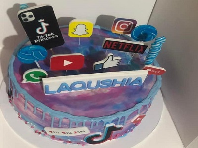 Tik tok inspired, Banana flavour cake and topped with edible image toppers, �galaxy� coloured buttercream and blue drip.<br>Posted: April 9th, 2022.