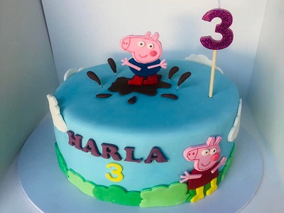 Peppa Pig inspired cake. Chocolate mudcake with handmade fondant decorations<br>Posted: April 9th, 2022.