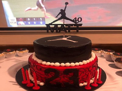  Jordan inspired theme cake with chocolate mudcake layered with dark chocolate ganache and decorated with fondant. Vanilla sponge cupcakes topped with buttercream and edible images<br>Posted: October 1st, 2021.